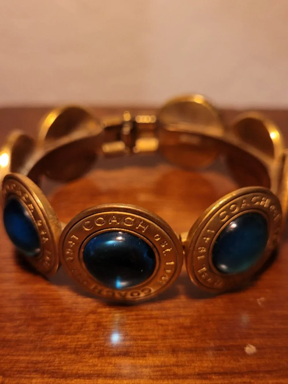 Coach Brass & Gemstone/Glass Cabochon Medallion Hinged Bangle Bracelet Blue